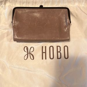 HOBO wallet, 2 outer areas and one magnetic inside.  Tan in color. Little use.